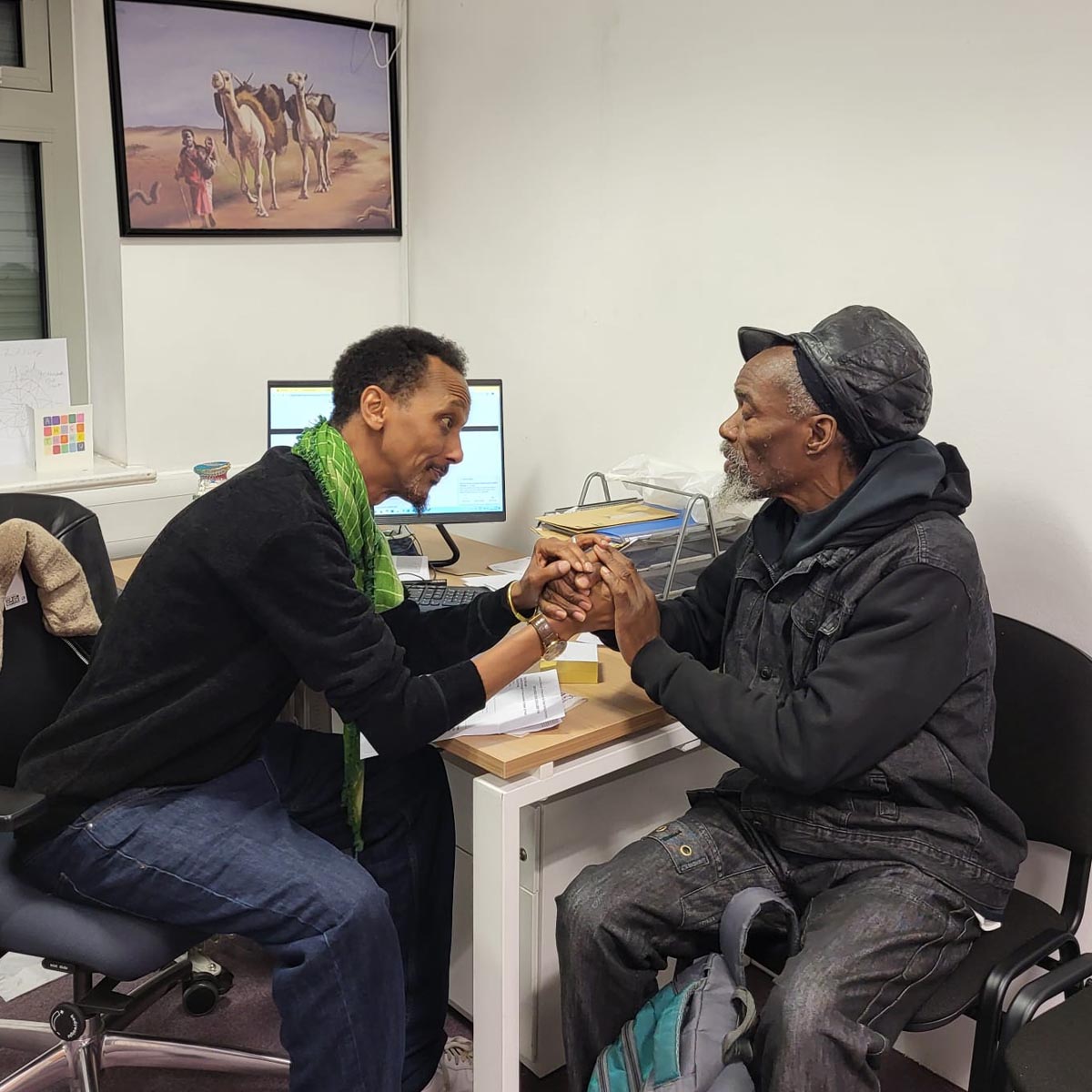 Daud offering compassionate hand-to-hand guidance to elder