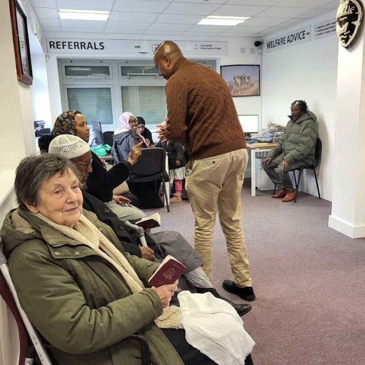 Diverse community members in welfare advice and referral centre